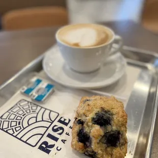 a blueberry muffin and a cup of coffee
