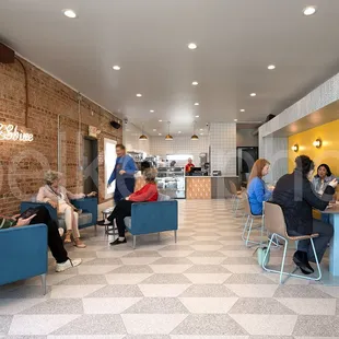a group of people sitting at tables