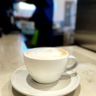a cup of coffee on a saucer