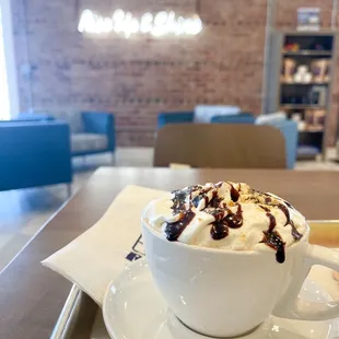 a cup of ice cream and a donut