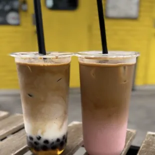 A large iced caramel macchiato with boba (left) and a large iced latte with raspberry flavoring (right)