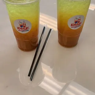 two drinks on a table with chopsticks