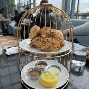 Korean fried chicken with scallion biscuits and sauce array