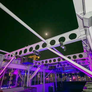 a view of the roof of a building at night