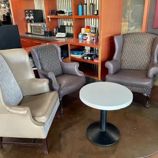 two chairs and a table in a store