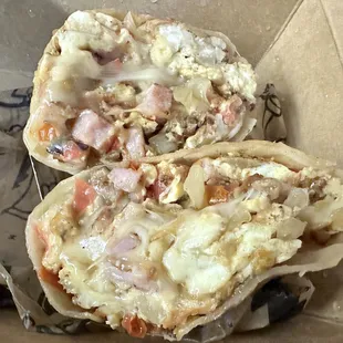 Local burrito (ham, sausage, scrambled egg, cheese, added tomatoes and onion for 50 cents each)