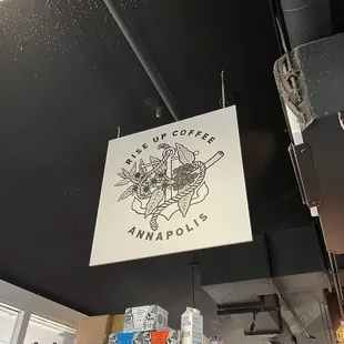 a sign hanging from the ceiling