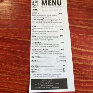 a menu on a wooden table