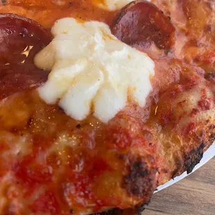 a slice of pepperoni and cheese pizza