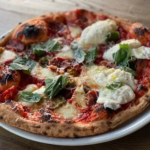 Half Burrata Pizza and half Calebrese and Raw Honey Pizza