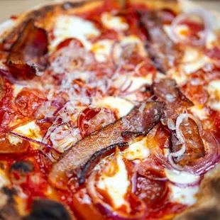 Double Pepperoni Pizza w/ extra Mozz, Red Onions, Bacon &amp; Truffle Oil ($22 + add-ons [you don&apos;t want to know])