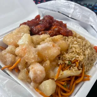a take out container of chinese food