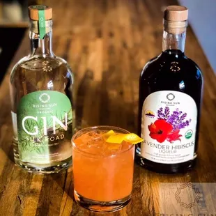 two bottles of gin and a cocktail