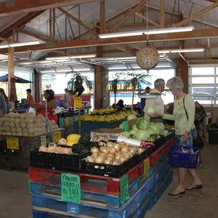 people shopping in the produce section