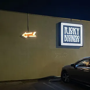 a car parked in front of a business