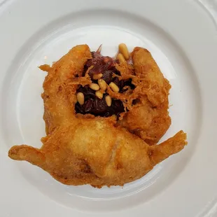 Fried Soft Shell Crab with sour onions, raisins, and pine nuts