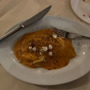 a plate of food with a fork and knife
