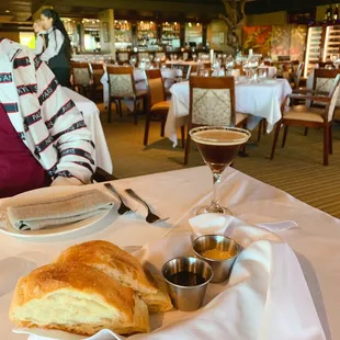 a plate of bread and a glass of wine