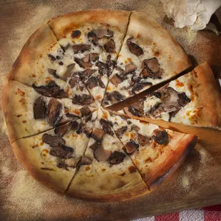 The Casanova Wood-fried Pizza Mozzarella, full circle mushrooms, truffle oil