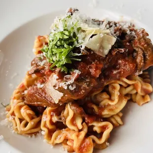 a plate of pasta and meat