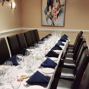 a long table set with place settings