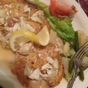 Flounder and crab meat dish. Tasted super fried and very soggy. awful garnish of iceburg lettuce and a tomato slice. no color.