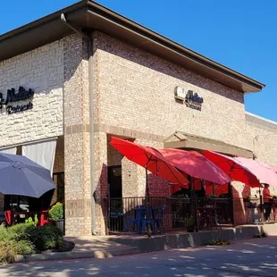 Outside.  The front entrance is hidden on the far left patio side.