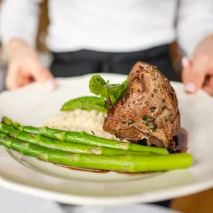 a person holding a plate of food