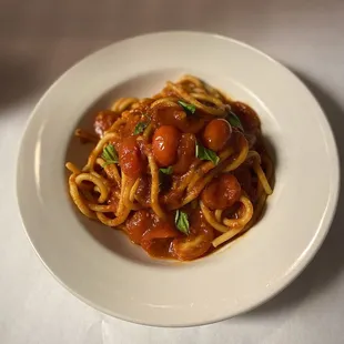 a plate of spaghetti with tomato sauce