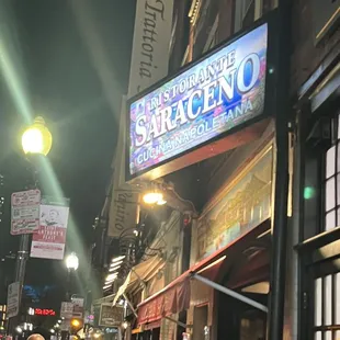 a crowd of people walking down the street