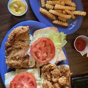Half fried oyster half crab po boy. Beyond excellent, tasty, flavorful, filling, served hot and fresh! Crab cake was GIANT and FULL OF CRAB.