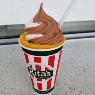 Their popular treat that is frozen custard at bottom and top of cup with Italian ice in the middle.