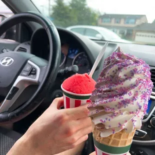 a person holding a cup of ice cream