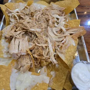 Pulled chicken nacho, added sour cream and limes