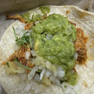 Al pastor pork tacos on a soft corn tortilla