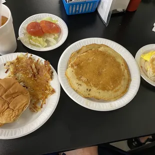 The Chick-Fil- A, hash browns, pancakes, egg and cheese biscuit