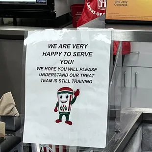 a sign stating that there are very happy to serve