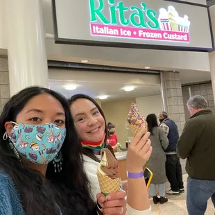 two women wearing face masks