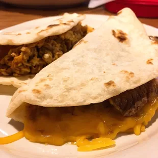 Carne guisada with cheese, chorizo and egg tacos