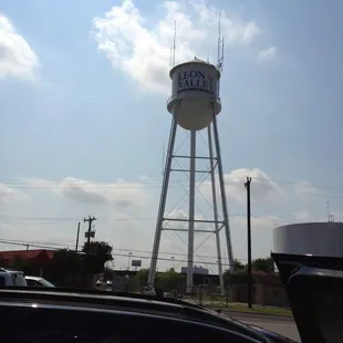 Next to the water tower n Shipleys donuts