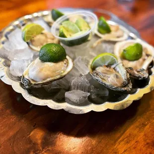 a platter of fresh oysters