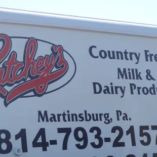 a sign for a dairy business