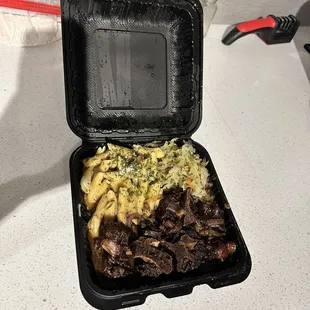 Oxtail Meal, with Rasta Pasta and Steamed Cabbage