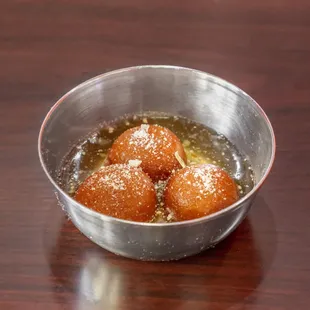 a bowl of fried doughnuts