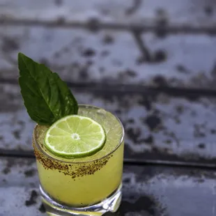 a margarita with a lime garnish