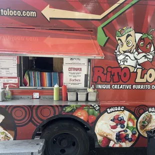 a man standing in front of a food truck