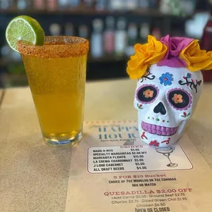 a drink and a sugar skull