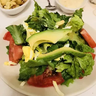 Extremely Basic Salad. They call it a chopped salad,  but it&apos;s basically a garden salad with small bits of eggs &amp; 2 small slices of avocado.