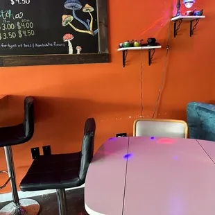 a pink table and chairs