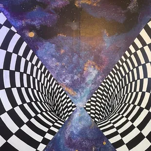 Mural in main hang out space where there's couches and the tv